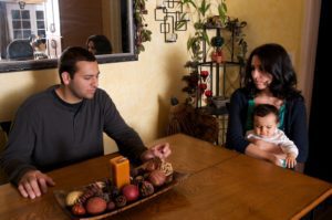 Both spouses negotiating about the family home property and sitting together